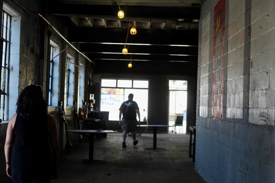 View through The Umbrella space with warm bulbs hanging inside 280 Blake Street